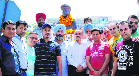 Local leaders garland the statue Kirti Chakra awardee Major Raman Dada on the occasion of his 13th martyrdom day in Jalandhar on Wednesday. 