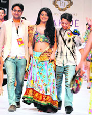 Designer duo Jai (left) and Parvesh walk the ramp with a show-stopper