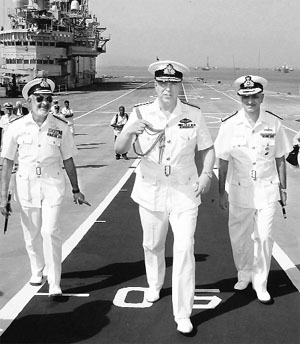 Duke of York Prince Andrew (c) visits INS Viraat with Western Naval Command Flag Officer Commanding-in-Chief Vice-Admiral DK Joshi, in Mumbai on Wednesday. 