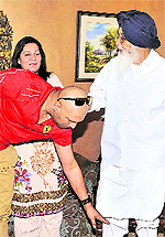 Cricketer Yuvraj Singh seeks the blessings of Chief Minister Parkash Singh Badal as his mother Shabnam Singh looks on
