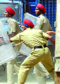 A file photo of policemen fighting a violent mob in Gurdaspur