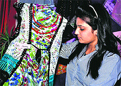 A student shows her creative dress inspired by hilly outfits of Uttarakhand at Pal Mansion in Haridwar on Thursday