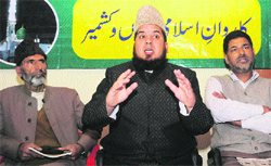 Karwan-i-Islami patron Maulana GR Hami addresses a press conference at the party headquarters in Srinagar on Thursday.