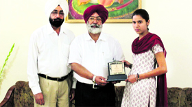 Beantpreet Kaur being felicitated for securing top position in the first semester examination of MA Punjabi, Panjab University.