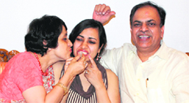 Surbhi Malik with her parents at their residence in Sector 7, Chandigarh.