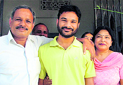 Himanshu Gupta, who secured the seventh rank in the civil services examination, with his parents in Ludhiana