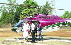 Collector Alex Paul Menon with BD Sharma arrives at Sukma from Chintalnar by a helicopter on Friday. 