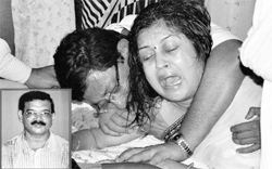 Swarnali Pathak, wife of Gadapani Pathak (inset), mourns the death of her husband at her residence in Guwahati on Friday. 