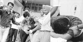 The injured youth with a knife stabbed at his back at the Civil Hospital in Dera Bassi on Saturday