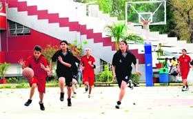 Players in action in a match in the Aspen Crew Basketball Tournament in Dehradun on Saturday