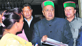 Union Minister Virbhadra Singh comes out of the Congress office after attending a meeting in Shimla on Saturday.
