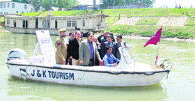 Divisional Commissioner, Kashmir, Asgar Hassan Samoon (centre) after inaugurating the water transport on the Jhelum in Srinagar on Saturday.