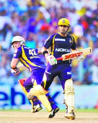 Kolkata Knight Riders Gautam Gambhir (R) and Brendon McCullum run between wickets at The Eden Gardens in Kolkata on Saturday