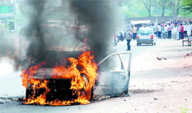 A car goes up in flames after catching fire near the Mela Ram Hospital in Bathinda early Sunday morning.