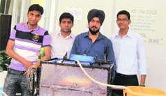 PEC University students with their shoe-washing machine.