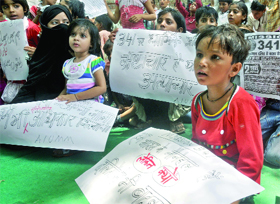 Children demanding the inclusion of Dalit Muslims in the SC category at Jantar Mantar on Sunday.