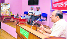 A speaker addresses a gathering during a function organised to mark Buddha Purnima in the University of Jammu on Sunday. 