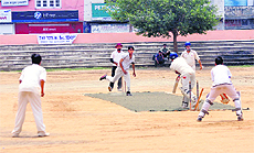 A bowler claims a wicket during a match in the Ashok Sodhi Memorial Cricket Tournament at Parade Ground in Jammu on Sunday.