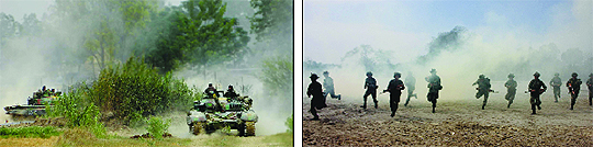 Soldiers in tanks and (right) jawans from Rising Star Corps participate in a war exercise of the Western Command in the plains of Punjab. 
