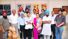 Alumni of the Chandigarh Art College at the painting exhibition at Virsa Vihar in Jalandhar on Sunday.