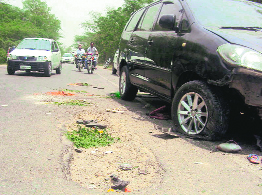 Big potholes on road at the accident site near Shekhupura village on the Ludhiana-Moga highway.