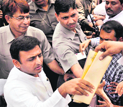Uttar Pradesh Chief Minister Akhilesh Yadav meets people at his residence in Lucknow on Sunday.