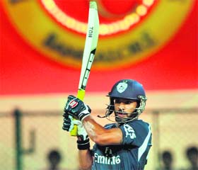 Deccan Chargers Shikhar Dhawan hits a shot at the M Chinnaswamy Stadium in Bangalore on Sunday