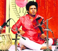 Violinist Johar Ali Khan performs at Springdales Senior Secondary School in Amritsar on Monday.