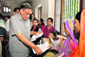 Uttarakhand Chief Minister Vijay Bahuguna meets people during his janta milan programme at his residence in Dehradun on Monday