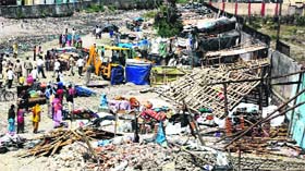 Encroachments being removed by Dehradun Municipal Corporation at MDDA colony,Chander Road in Dehradun on Monday