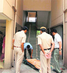 The police inspects the spot where Meenakshi fell to her death in Gurgaon on Monday. 