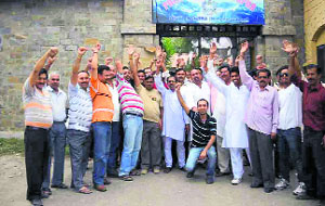 Shopkeepers of Jassur town hold a demonstration in front of the Nurpur police station on Sunday.  