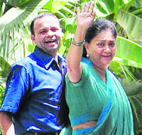BJP leader Vasundhara Raje with a supporter at her residence in Jaipur on Monday. 