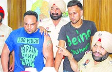 The murder accused in police custody in Jalandhar on Monday.