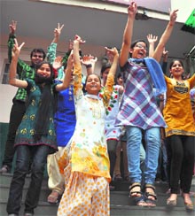 Students of Shiksha Niketan Senior Secondary School in a jubilant mood after the declaration of results in Jammu on Monday. 