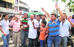 PDP activists stage a protest in Jammu on Monday. 