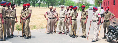 Policemen outside the residence of Education Minister Sikandar Singh Maluka. Tribune photo: Pawan Sharma