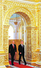 President Vladimir Putin (left) and former president Dmitry Medvedev walk in Moscows Kremlin during an inauguration ceremony on Monday.