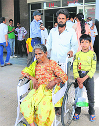 A dejected and ailing Ram Rakhi leaves the PGI without treatment following a strike by doctors on Tuesday