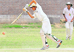 A Mohali batsman plays a shot against Chandigarh during their match at the YPS, Phase VII, Mohali, on Tuesday