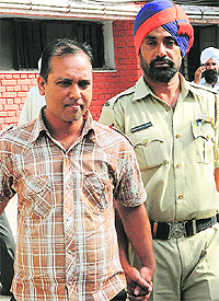 Sachin, one of the accused in the kidney scam, being taken to the District Courts in Mohali on Tuesday