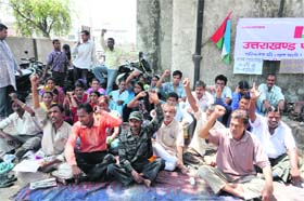 Members of the Uttarakhand Parivartan Party hold a demonstration in support of their demands in Dehradun on Tuesday