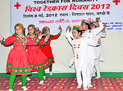 Hearing-impaired children perform a dance on World Red Cross Day in Mandi