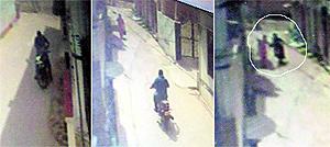 CCTV footage catches the snatcher standing on the road; following a teacher and snatching her purse in Azad Nagar