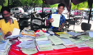 Vendors sell forms at District Administrative Complex in Jalandhar. 