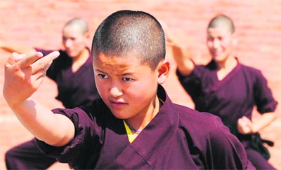 Buddhist nuns of the Amitabha Drukpa Nunnery practice kung fu on the outskirts of Kathmandu. The sisters, aged from nine to 52, come from Nepal, India, Tibet and Bhutan to learn the martial art form.