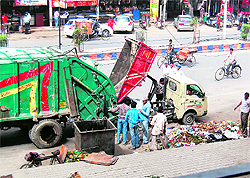 Work to lift garbage resumes after a gap of four days in Amritsar on Wednesday