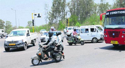 Vehicle-users drive haphazardly as traffic lights are non-functional at the Hallo Majra junction in Chandigarh on Wednesday.