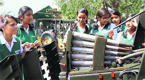 Students having a glimpse of the arms on display at Panchkula on Wednesday.