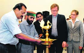 Uttarakhand Agriculture Minister Mantri Prasad Naithani (in cap) inaugurates the SMS-based agri information service at a function in Dehradun on Wednesday